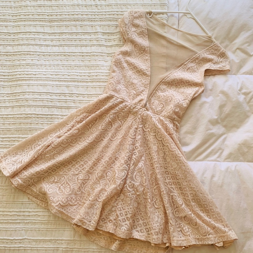 Deep cut dress with modest veiled bodice, swirly-sewn skirt, sweet cap sleeves